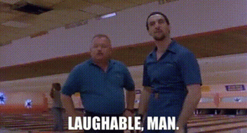 Two Men Are Standing Next To Each Other In A Bowling Alley And The Words Laughable Man Are Written On The Screen . GIF