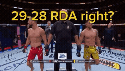 Two Men Are Standing Next To Each Other In A Boxing Ring With The Words 29-28 Rda Right Written Above Them GIF