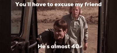Two Men Are Standing Next To Each Other In A Car Doorway . GIF