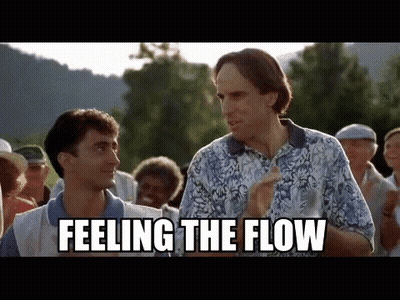 Two Men Are Standing Next To Each Other In A Crowd And One Of Them Is Saying `` Feeling The Flow '' . GIF