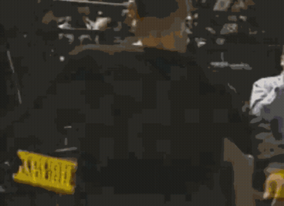 Two Men Are Standing Next To Each Other In A Dark Room And One Has The Number 10 On His Shirt GIF