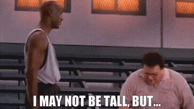 Two Men Are Standing Next To Each Other In A Gym And One Of Them Is Saying I May Not Be Tall But GIF