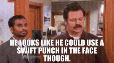 Two Men Are Standing Next To Each Other In A Room . GIF