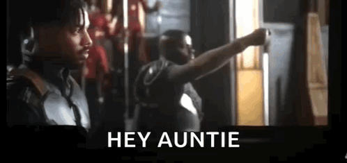 Two Men Are Standing Next To Each Other In A Room And One Of Them Is Pointing At The Camera . GIF