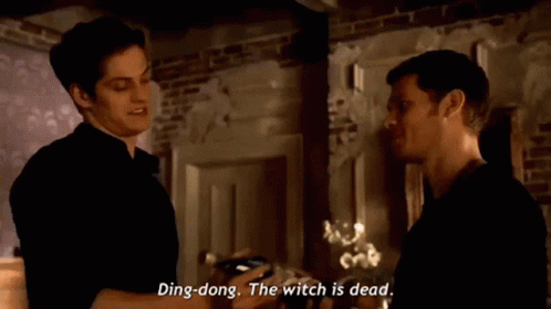 Two Men Are Standing Next To Each Other In A Room And One Of Them Is Saying Ding Dong The Witch Is Dead GIF