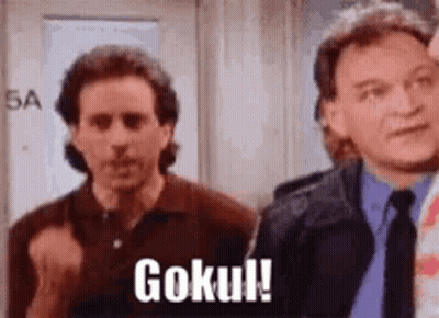 Two Men Are Standing Next To Each Other In A Room And One Of Them Is Saying `` Goku ! '' GIF