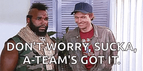 Two Men Are Standing Next To Each Other In A Room And One Of Them Is Wearing A Baseball Cap . GIF