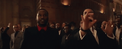 Two Men Are Standing Next To Each Other In A Room . GIF