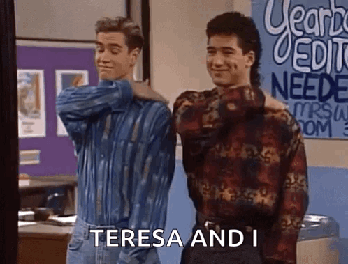 Two Men Are Standing Next To Each Other In Front Of A Sign That Says ' Teresa And I ' On It . GIF