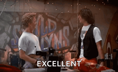 Two Men Are Standing Next To Each Other In Front Of A Wall With The Word Excellent Written On It . GIF