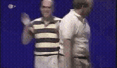 Two Men Are Standing Next To Each Other On A Blue Background . GIF
