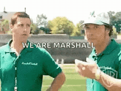 Two Men Are Standing Next To Each Other On A Field With The Words `` We Are Marshall '' Written On The Bottom . GIF