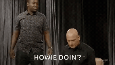 Two Men Are Standing Next To Each Other On A Stage And One Of Them Is Asking The Other To Do Something . GIF