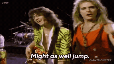 Two Men Are Standing Next To Each Other On A Stage And One Of Them Is Saying `` Might As Well Jump '' . GIF