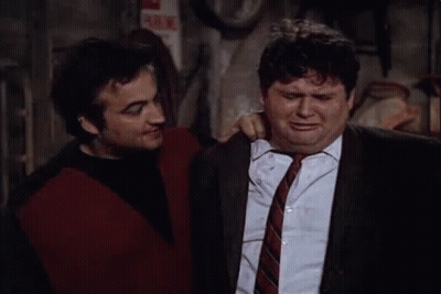 Two Men Are Standing Next To Each Other , One Is Holding A Can Of Beer And The Other Is Crying . GIF