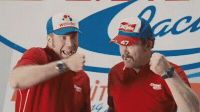 Two Men Are Standing Next To Each Other With One Wearing A Wonder Hat . GIF