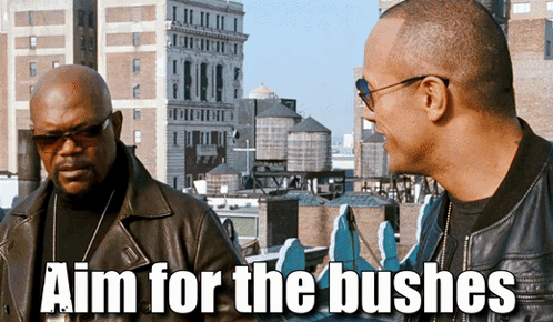 Two Men Are Standing Next To Each Other With The Words Aim For The Bushes Above Them GIF