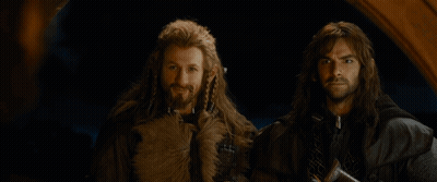 Two Men Are Standing Next To Each Other With The Words At Your Service Written On The Bottom GIF