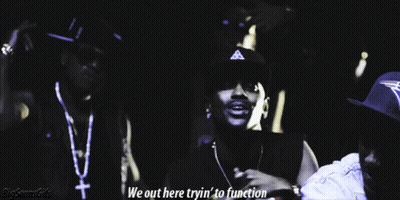 Two Men Are Standing Next To Each Other With The Words We Out Here Tryin ' To Function Below Them GIF