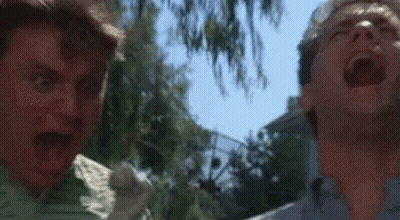 Two Men Are Standing Next To Each Other With Their Mouths Open And One Is Screaming . GIF