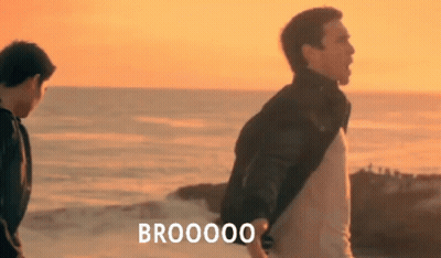 Two Men Are Standing On A Beach With The Words Brooooo Written On The Bottom GIF