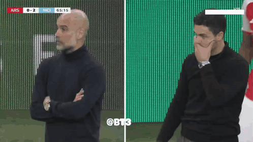 Two Men Are Standing On A Soccer Field And One Has A Watch On GIF