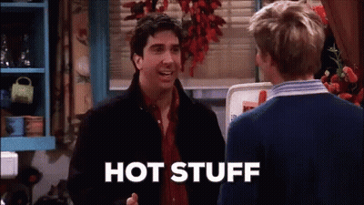 Two Men Are Talking In A Kitchen And One Of Them Is Saying Hot Stuff GIF