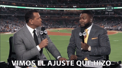 Two Men Are Talking In Front Of A Fox Sports Stadium GIF