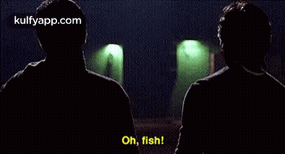 Two Men Are Talking To Each Other In A Dark Room And One Of Them Is Saying `` Oh , Fish '' . GIF