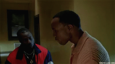 Two Men Are Talking To Each Other In A Room In A Movie . GIF
