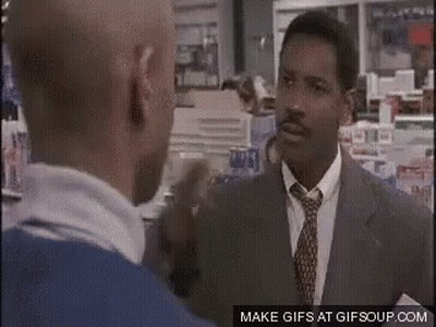 Two Men Are Talking To Each Other In A Store . GIF