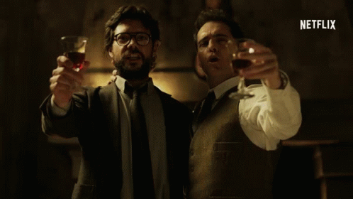 Two Men Are Toasting With Wine Glasses And The Word Netflix Is Visible In The Corner GIF
