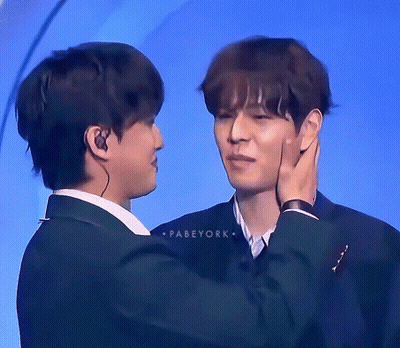 Two Men Are Touching Each Other 'S Faces And The Words Pabeyork Are On The Bottom GIF