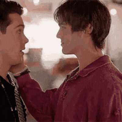 Two Men Are Touching Each Other 'S Faces . GIF