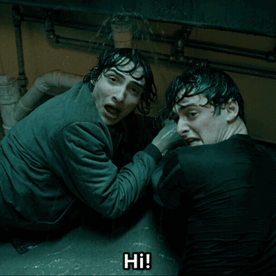 Two Men Are Under A Sink And One Of Them Is Screaming Hi GIF
