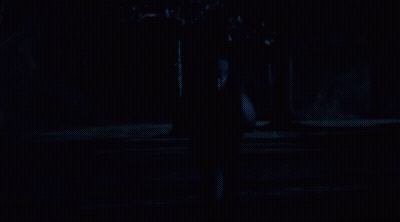 Two Men Are Walking In The Dark And One Has A Hoodie On GIF