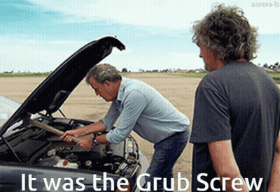 Two Men Are Working On A Car With The Words It Was The Grub Screw Written Below Them GIF