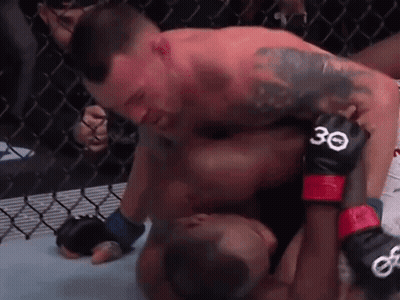 Two Men Are Wrestling In A Cage And One Of Them Has The Number 30 On His Gloves . GIF