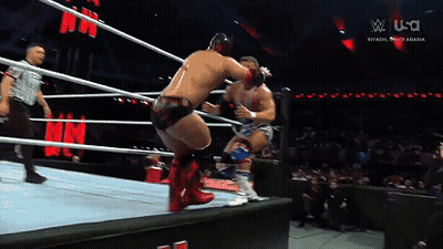 Two Men Are Wrestling In A Ring With A Sign That Says U.s.a. GIF