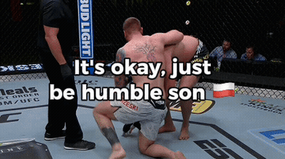 Two Men Are Wrestling In A Ring With The Words " It 'S Okay Just Be Humble Son " GIF