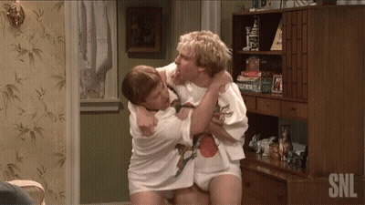 Two Men Are Wrestling In A Room With Snl Written On The Bottom Right GIF