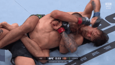 Two Men Are Wrestling In A Ufc Match With The Time Of 1:33 GIF