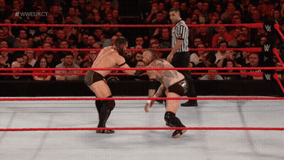 Two Men Are Wrestling In A Wrestling Ring With A Referee And #Wweukct Written On The Screen GIF