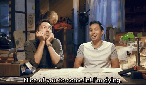 Two Men At Desk With Nice Of You To Come In I'm Dying GIF