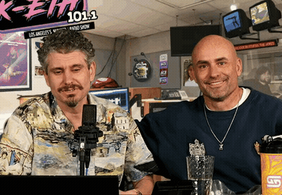 Two Men at Microphone With 101.1 Sign