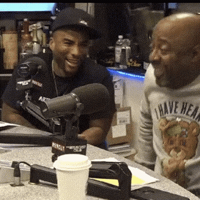 Two Men At Microphone With 'I Have Heard' Sweater GIF
