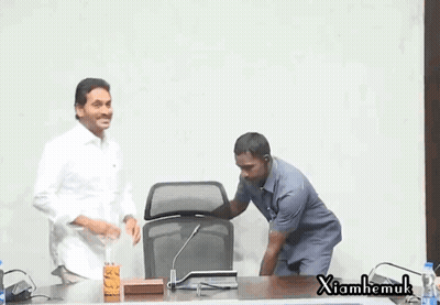 Two Men At Microphone With Xiahemuk Sign GIF
