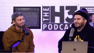 Two Men At Microphones In Front Of The H3 Podcast Sign GIF