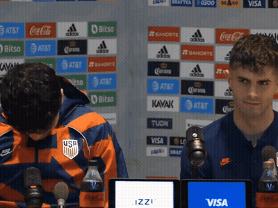Two Men at Microphones With Visa AT&T Wall