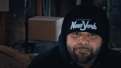 Two Men At Table One Wearing Supreme Sweatshirt GIF